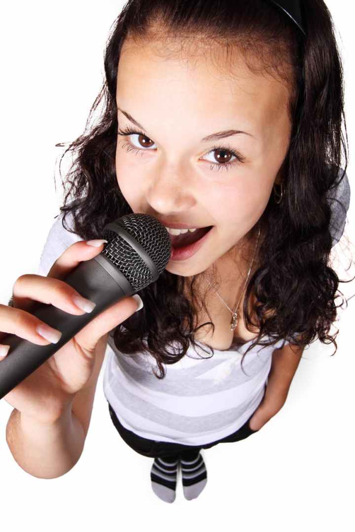 woman holding black microphone