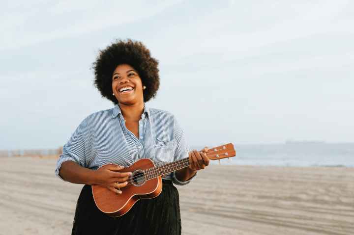 woman playing ukulele